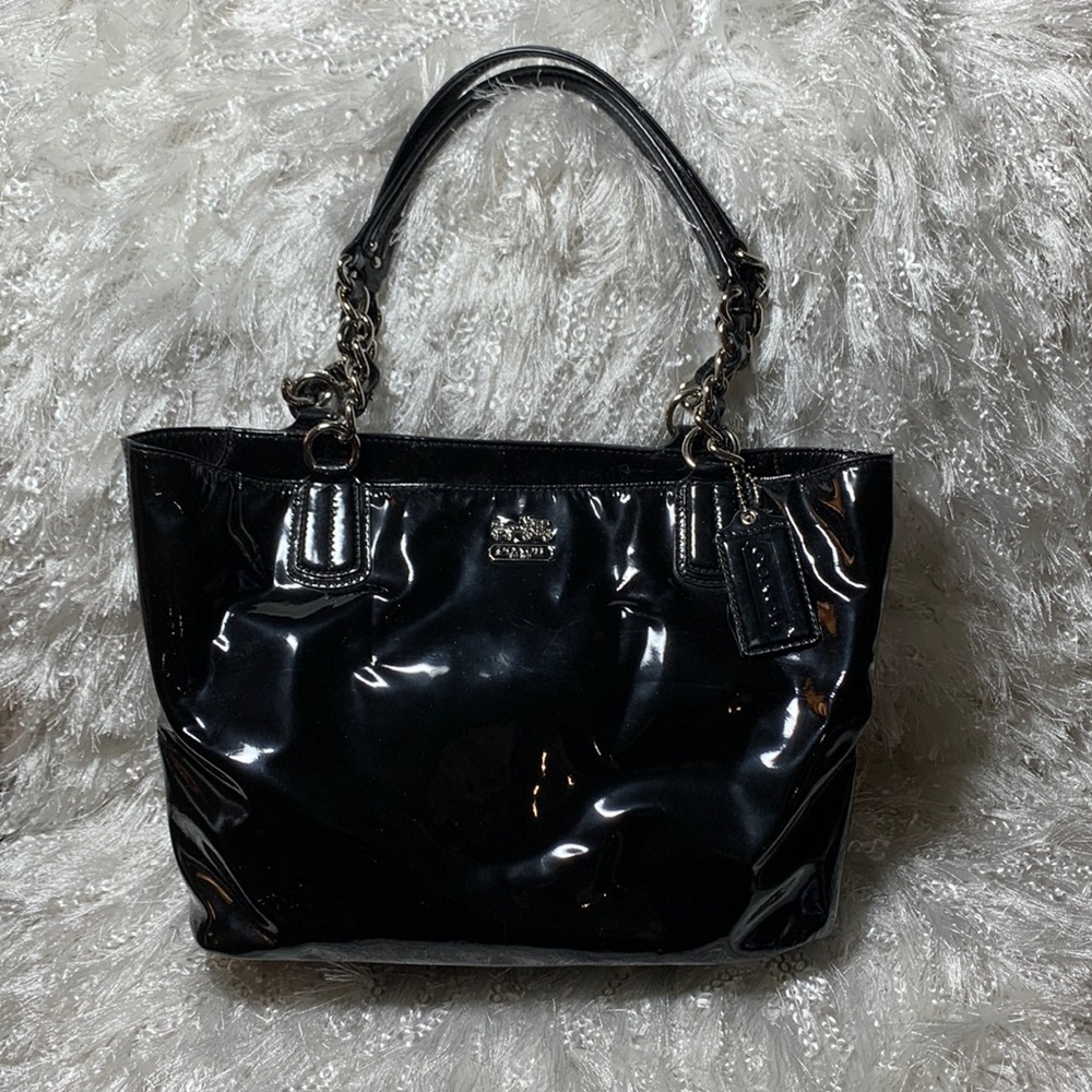 Black patent leather Coach shoulder bag.